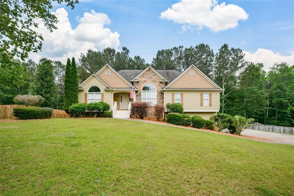 948 Cable Road Waleska, GA 30183 - Photo 1 of 1 a front view of a house with a yard and garage