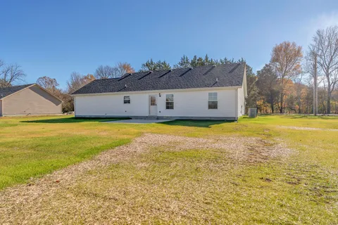 a view of a swimming pool with an outdoor space and seating area