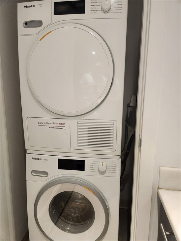 110 Stuart Street, Unit 19D Boston, MA 02116 - Photo 17 of 18 a utility room with dryer and washer