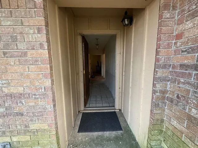 a view of hallway with wooden floor