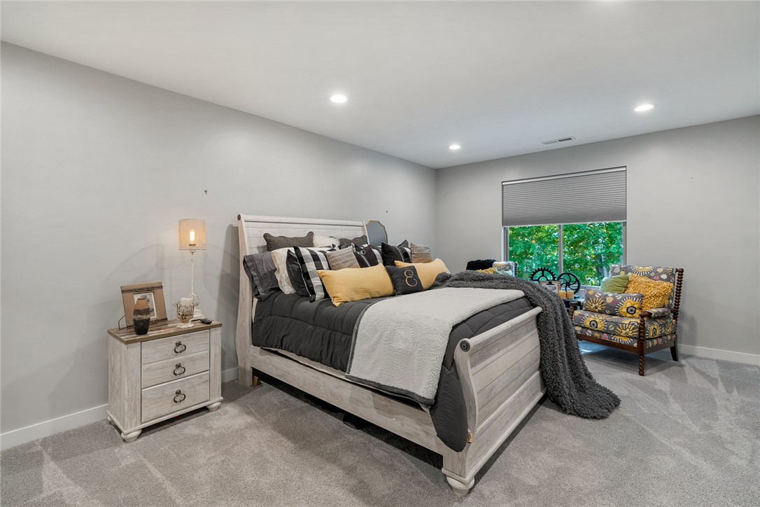 140 Turnberry Road Anderson, SC 29621 - Photo 20 of 44 This cozy bedroom features plush carpeting and abundant natural light, offering a comfortable and serene retreat.