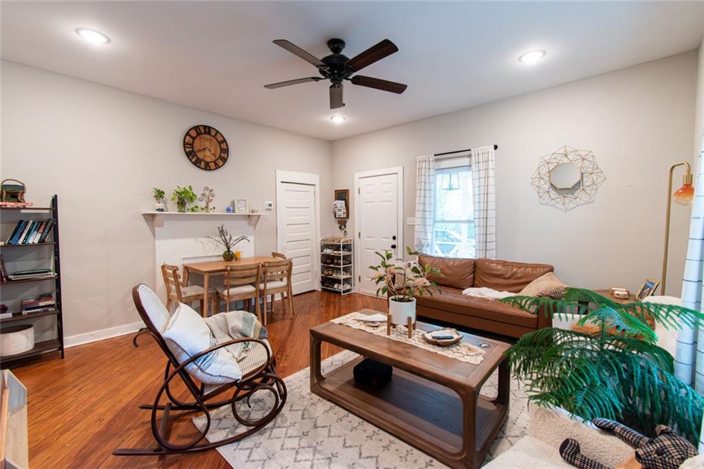 702 Radford Street Monroe, GA 30655 - Photo 7 of 49 a living room with furniture and a large window