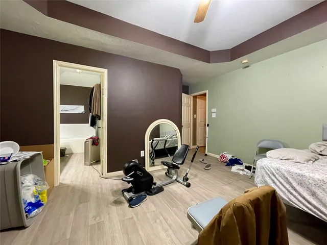 a bed room with a bed and a mirror