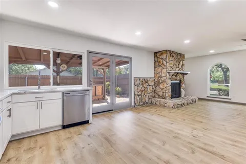 a view of a room with window and cabinet