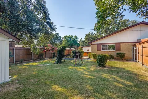 a house with swimming pool in front of it