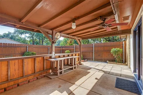 a view of a chairs and table in the patio