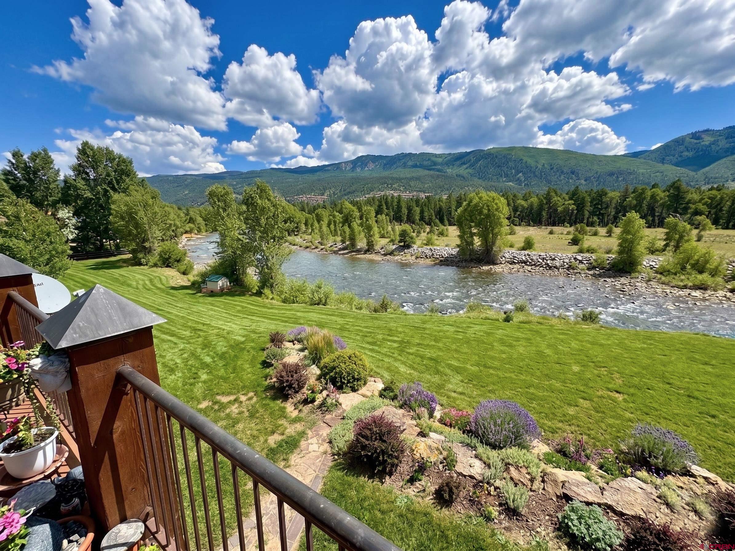 300 Animas Springs Road Durango, CO 81301 - Photo 14 of 44 a view of a garden with an ocean