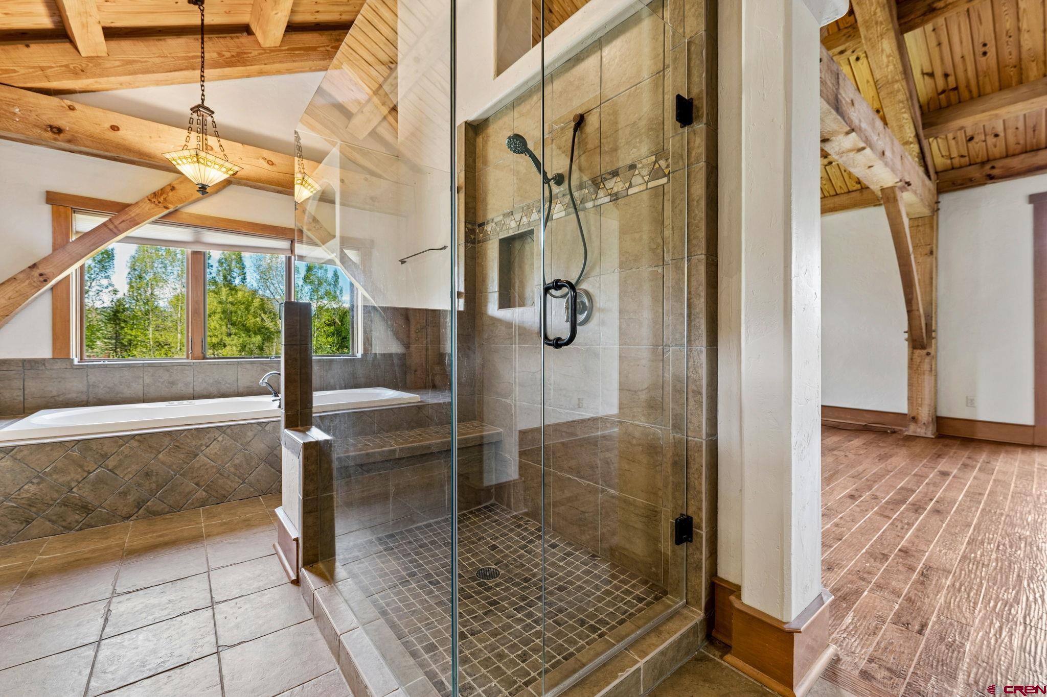 300 Animas Springs Road Durango, CO 81301 - Photo 23 of 44 a bathroom with a glass shower door