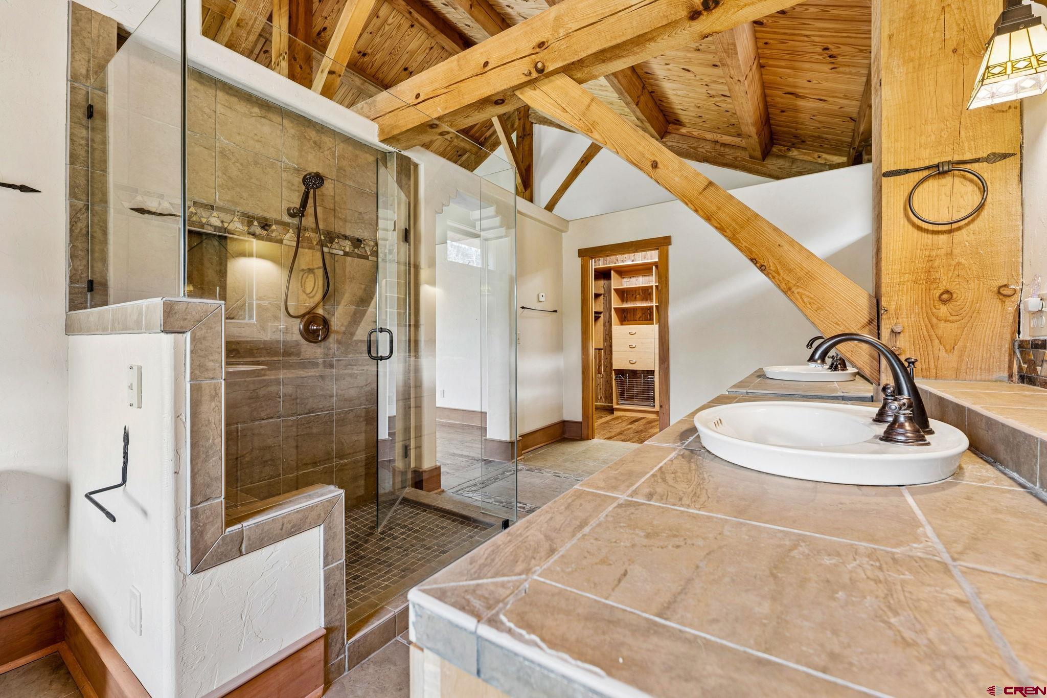 300 Animas Springs Road Durango, CO 81301 - Photo 24 of 44 a bathroom with a sink a toilet and shower