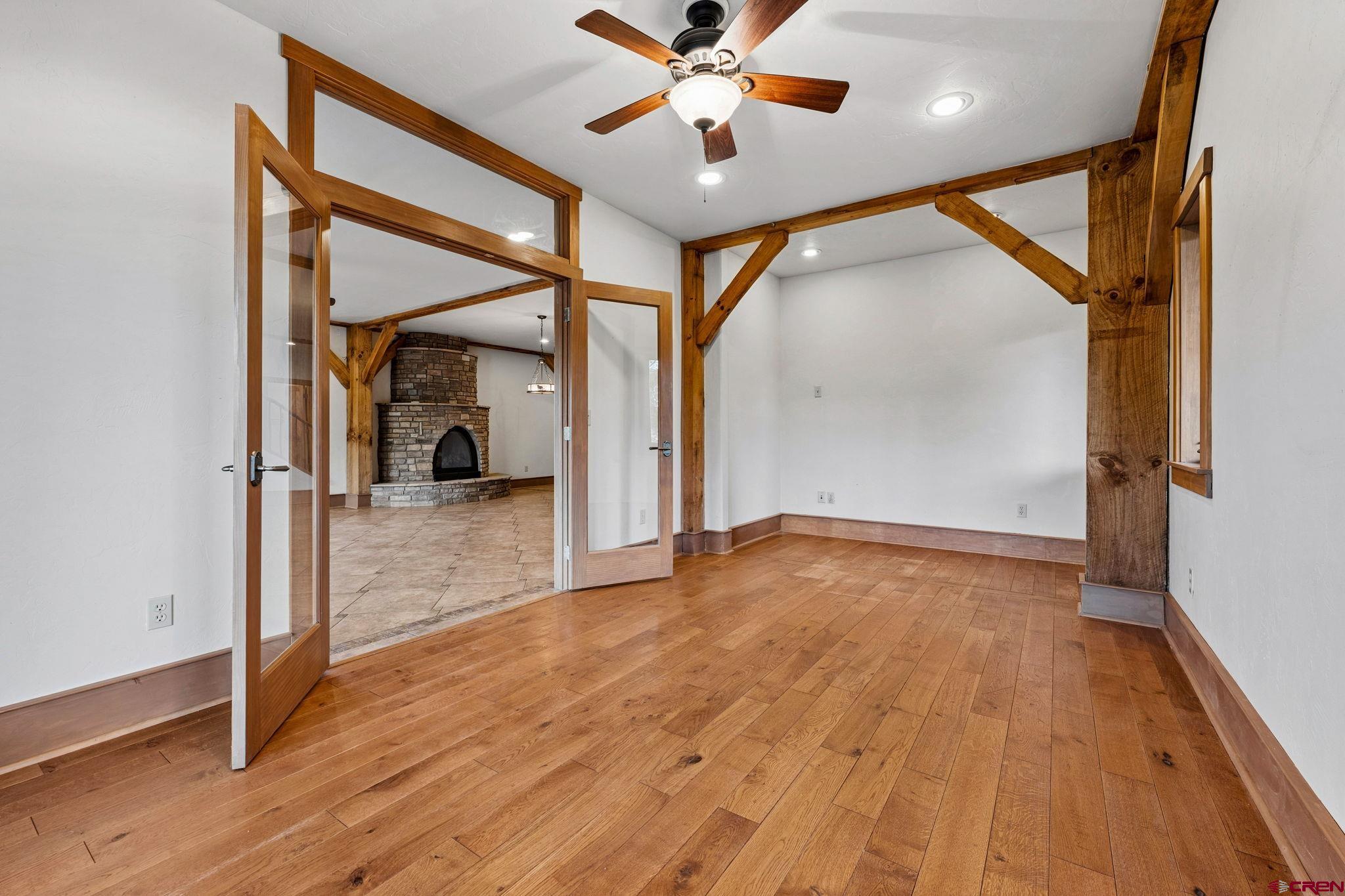 300 Animas Springs Road Durango, CO 81301 - Photo 38 of 44 wooden floor in an empty room with a window