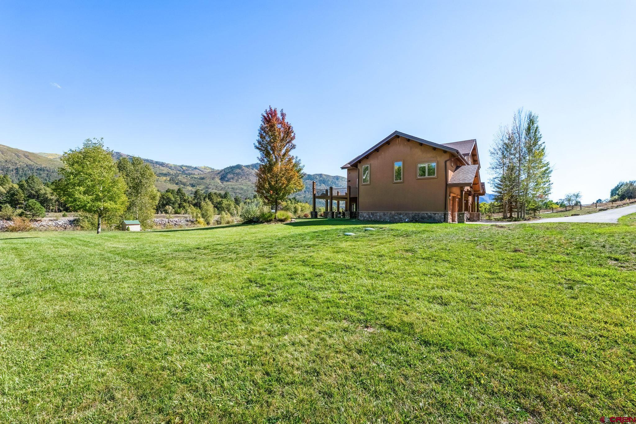 300 Animas Springs Road Durango, CO 81301 - Photo 40 of 44 a house with garden in front of it