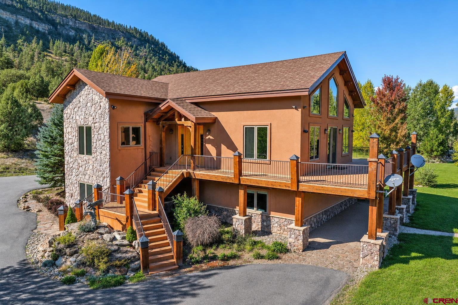 300 Animas Springs Road Durango, CO 81301 - Photo 5 of 44 front view of a house with a small yard