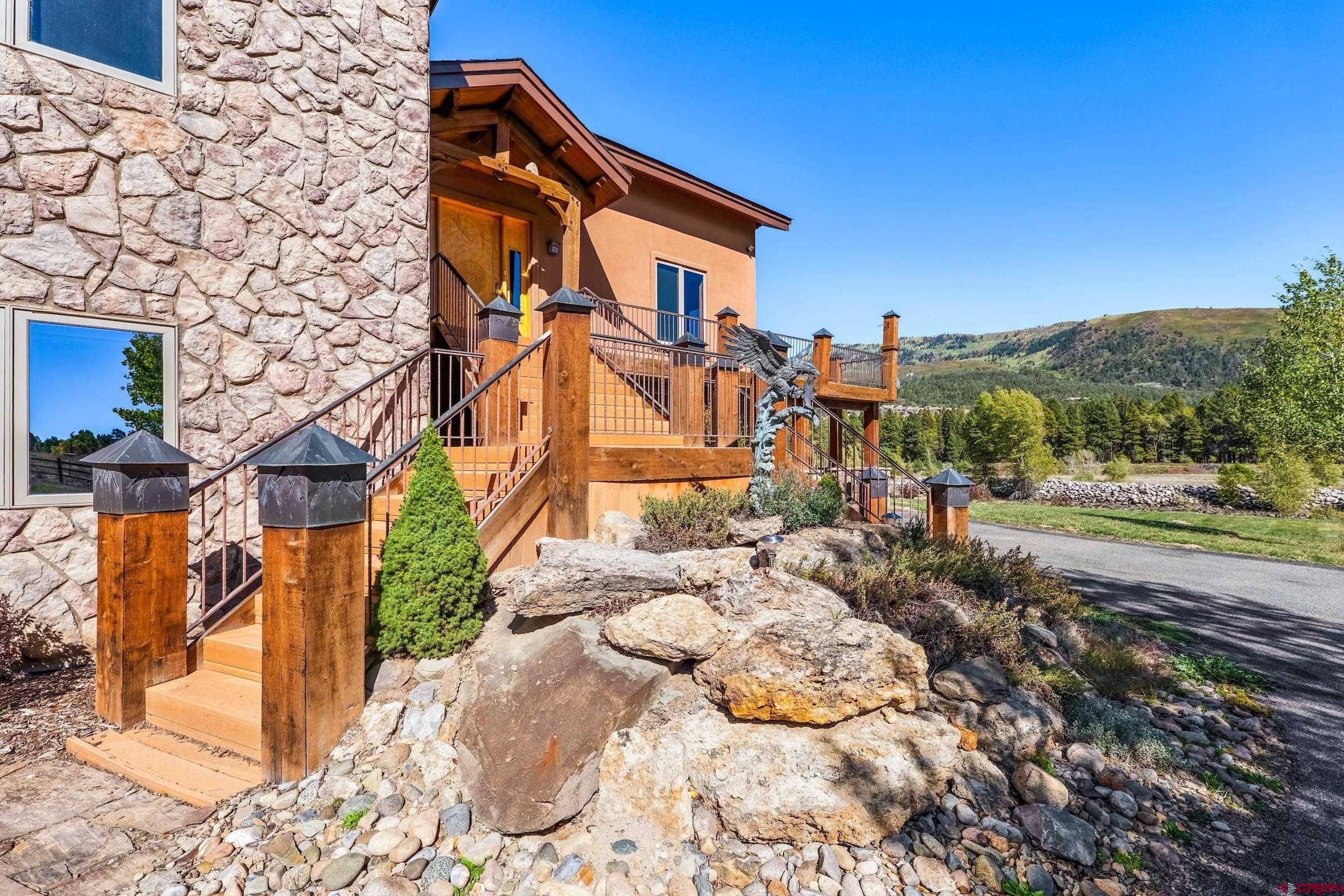 300 Animas Springs Road Durango, CO 81301 - Photo 6 of 44 a view of a house with a yard