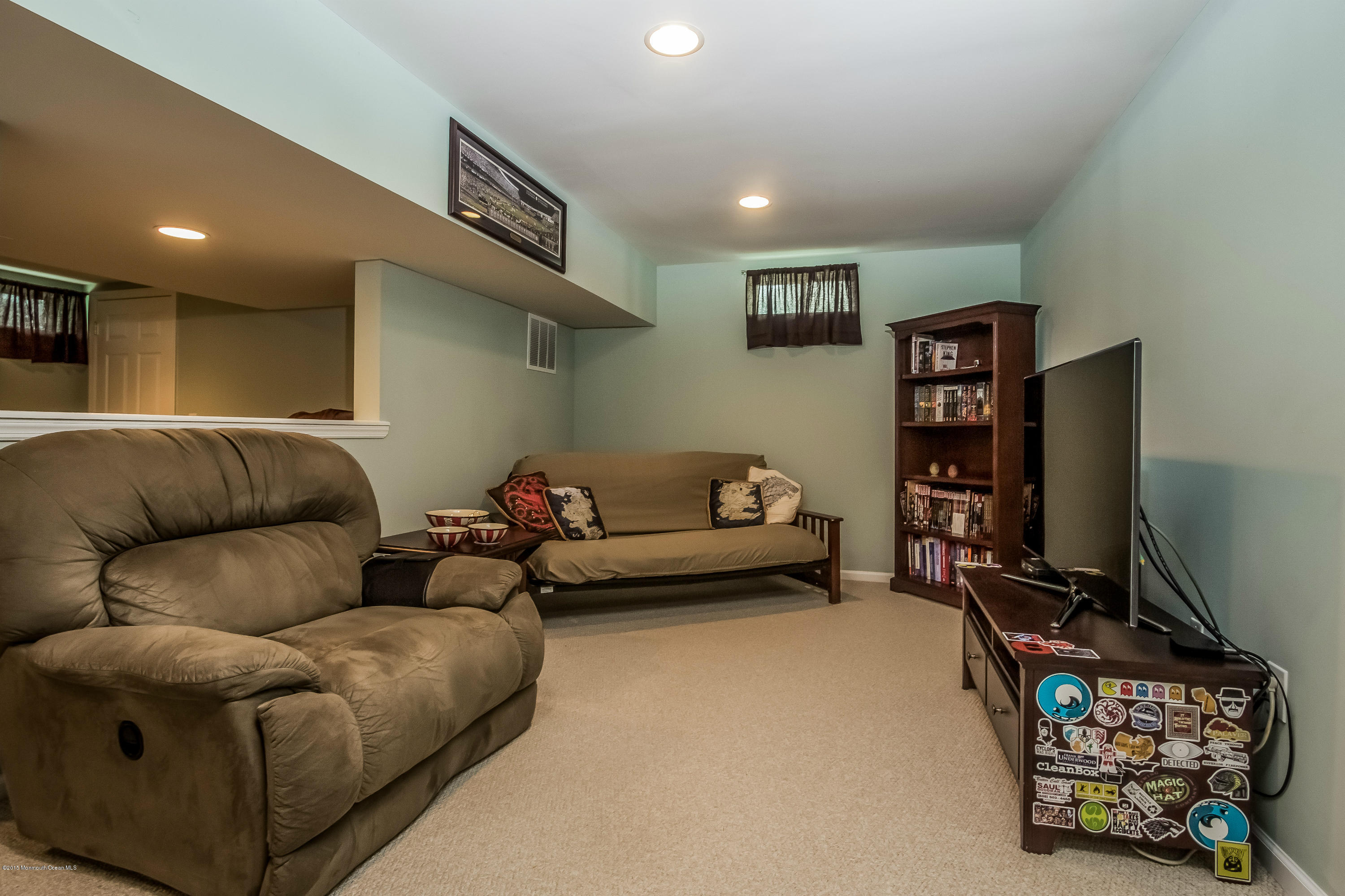 17 Rizzo Court Howell, NJ 07731 - Photo 11 of 15 a living room with furniture a couch and a flat screen tv