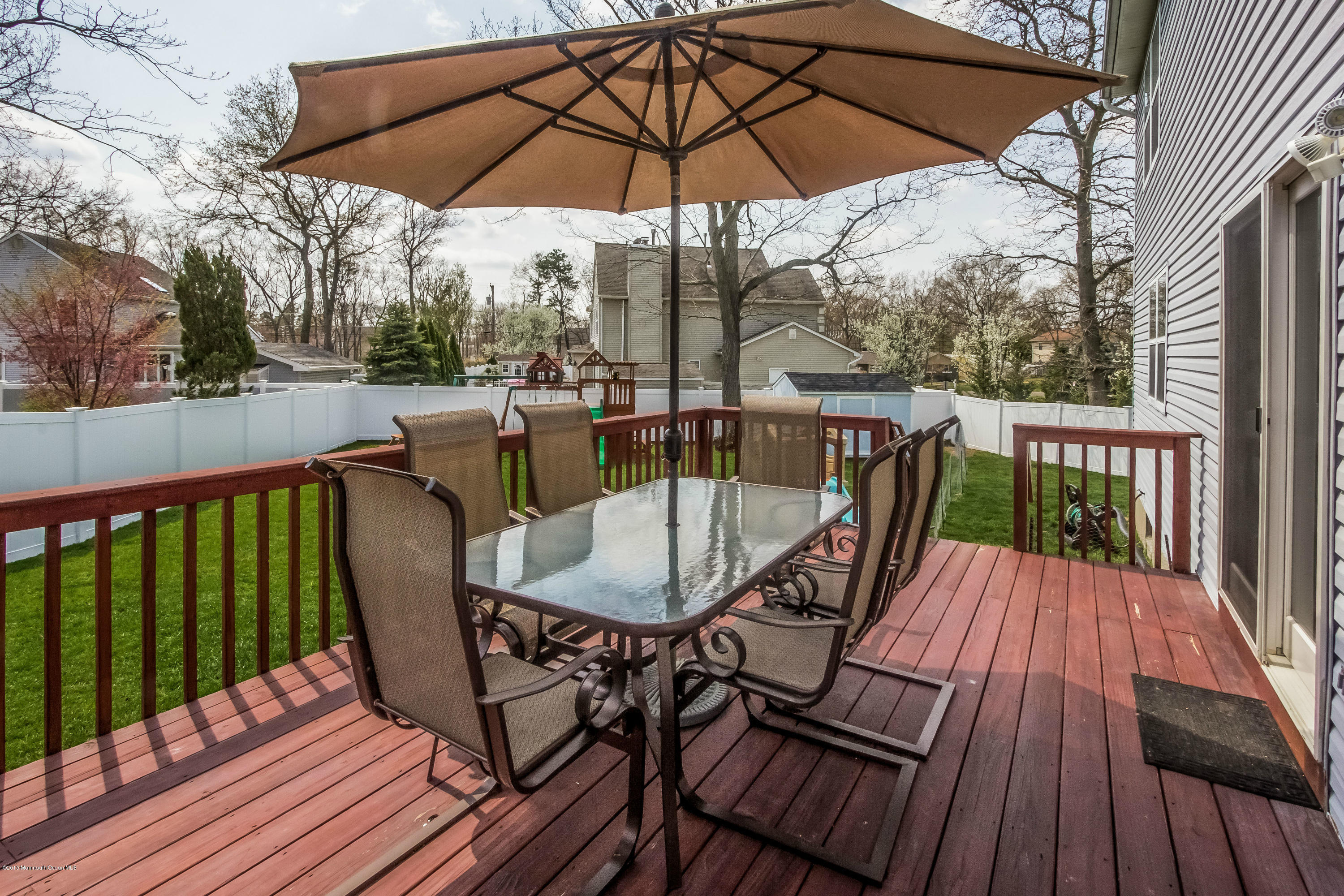 17 Rizzo Court Howell, NJ 07731 - Photo 12 of 15 a view of balcony with furniture and wooden deck