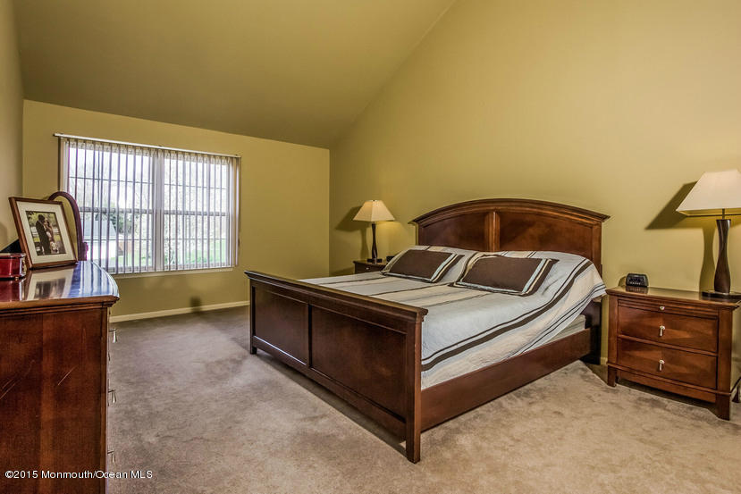 17 Rizzo Court Howell, NJ 07731 - Photo 7 of 15 a bed sitting in a bedroom next to a window