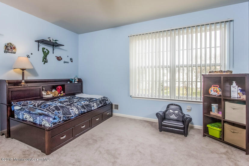 17 Rizzo Court Howell, NJ 07731 - Photo 8 of 15 a bedroom with bed and a window