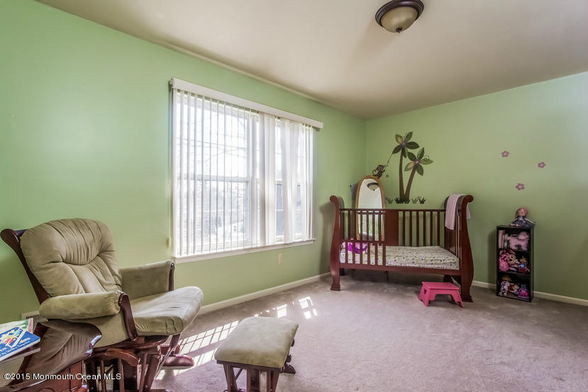 17 Rizzo Court Howell, NJ 07731 - Photo 9 of 15 a living room with furniture and a window