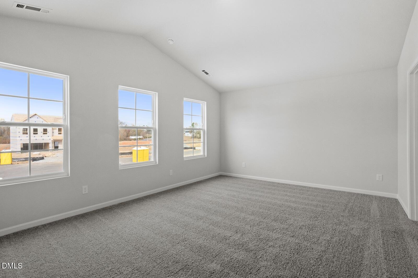 79 Osgood Street Angier, NC 27501 - Photo 19 of 31 an empty room with windows