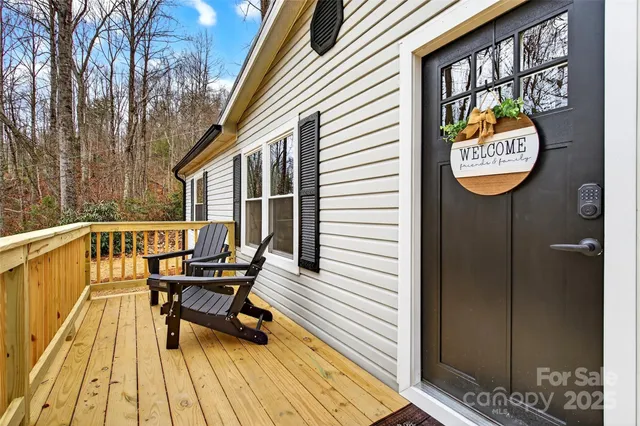 a view of sitting area with furniture and wooden floor