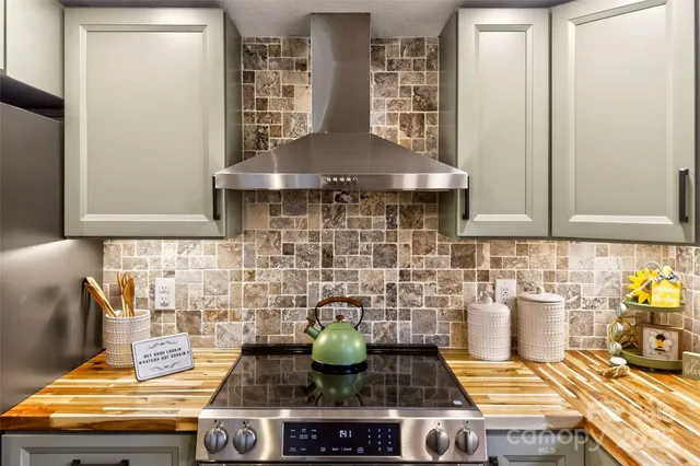 a kitchen with a stove and cabinets