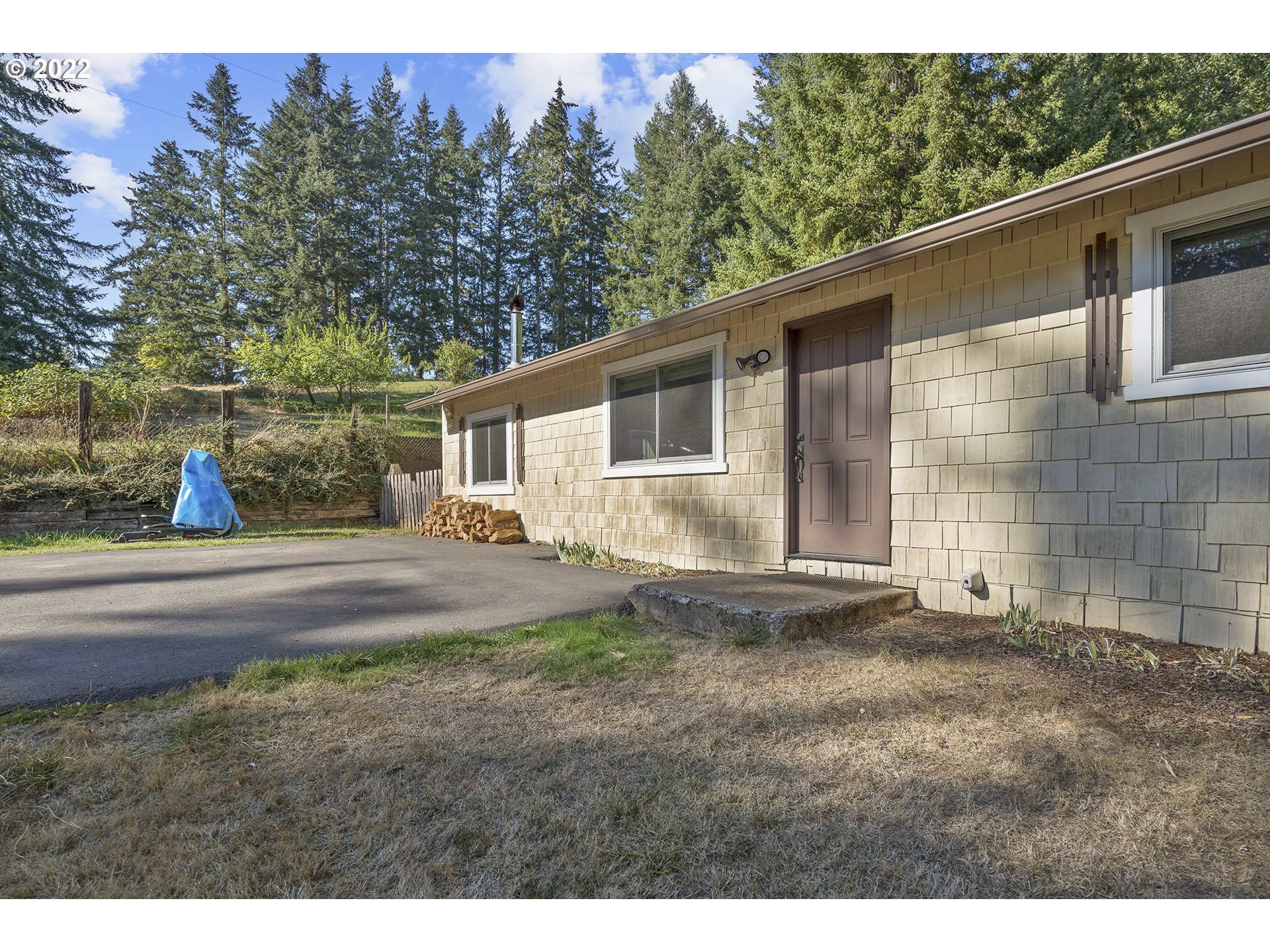 21915 South Green Mountain Road Colton, OR 97017 - Photo 2 of 32 a view of a house with backyard and trees