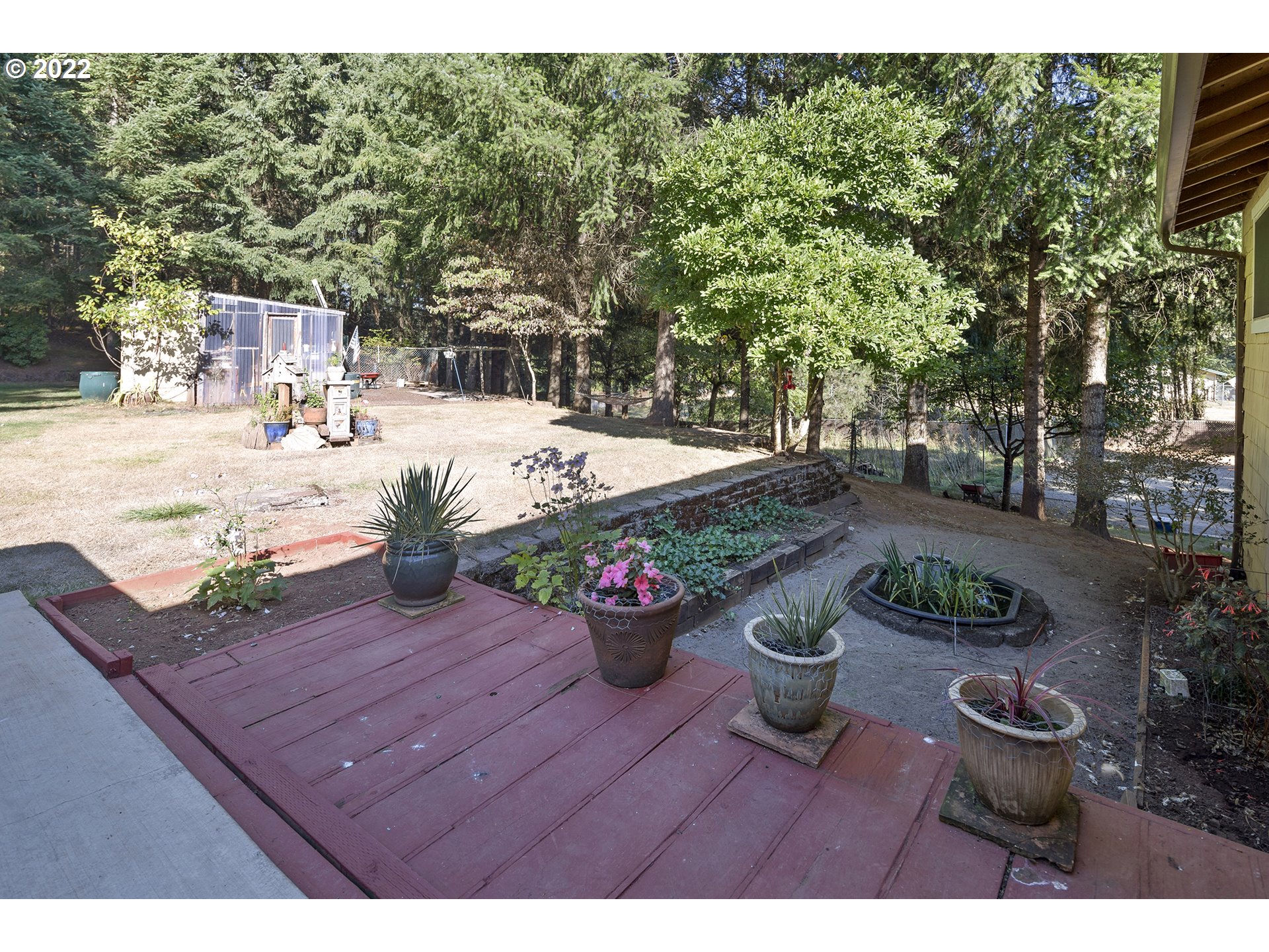 21915 South Green Mountain Road Colton, OR 97017 - Photo 26 of 32 a view of a backyard with sitting area
