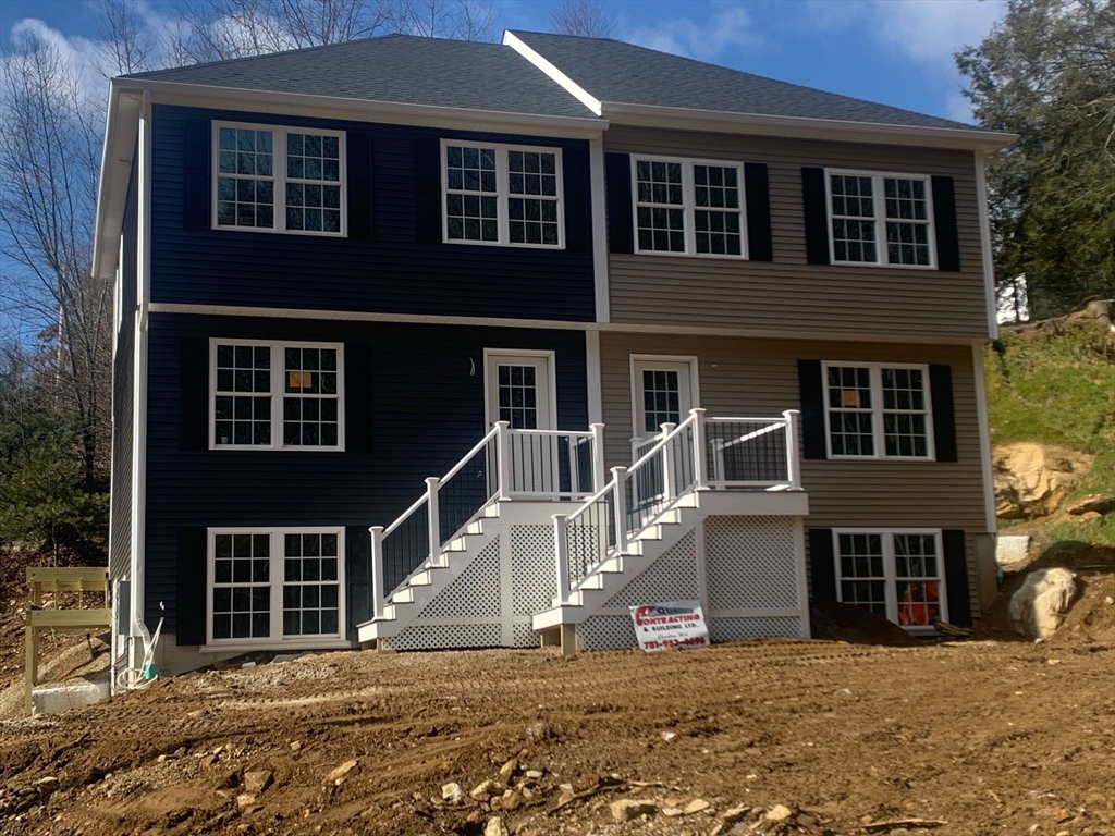 60 Hill Road, Unit B Charlton, MA 01507 - Photo 1 of 11 a view of a house with windows