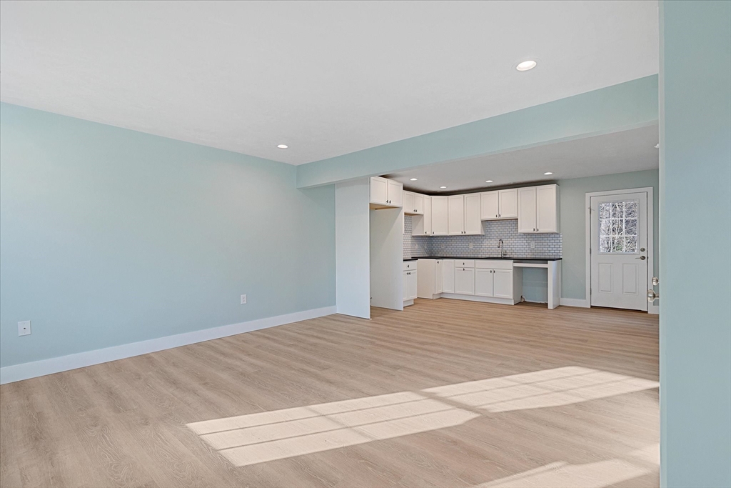60 Hill Road, Unit B Charlton, MA 01507 - Photo 2 of 11 a view of a kitchen with a sink and a refrigerator