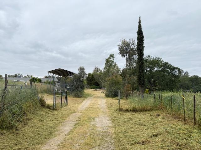 28826 Auberry Road Prather, CA 93651 - Photo 13 of 48 a view of a lake with a yard and mountain view