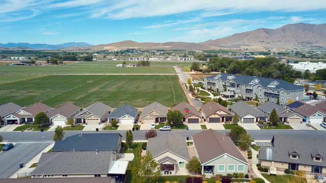 1204 South 1150th Street West Payson, UT 84651 - Photo 14 of 26 Aerial perspective showcasing a residential community with single-family homes and multi-story apartment buildings