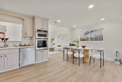 a view of kitchen with sink and microwave