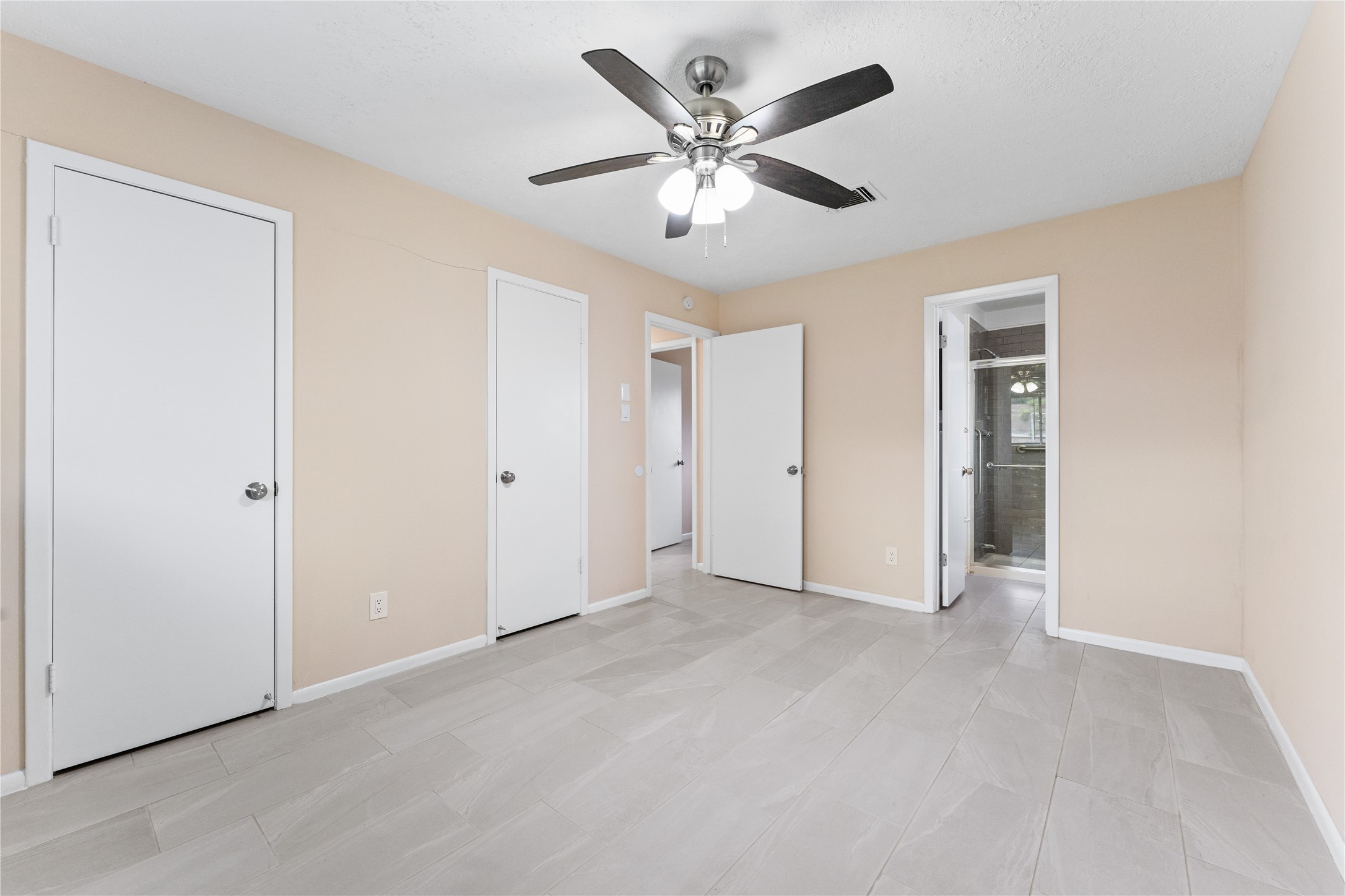 1431 Epsilon Street Pasadena, TX 77504 - Photo 12 of 21 a view of an empty room with a ceiling fan