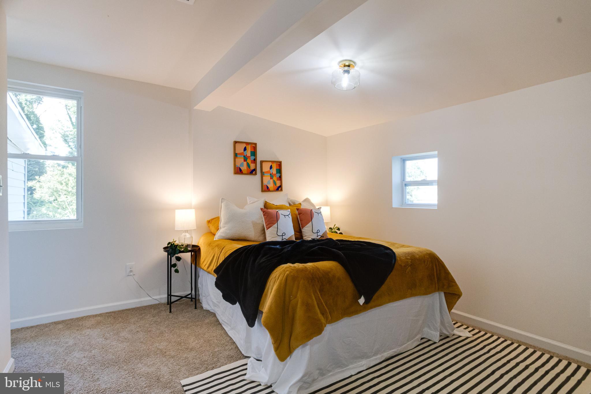 4417 Walnut Road Halethorpe, MD 21227 - Photo 19 of 44 a bed room with a bed and a window