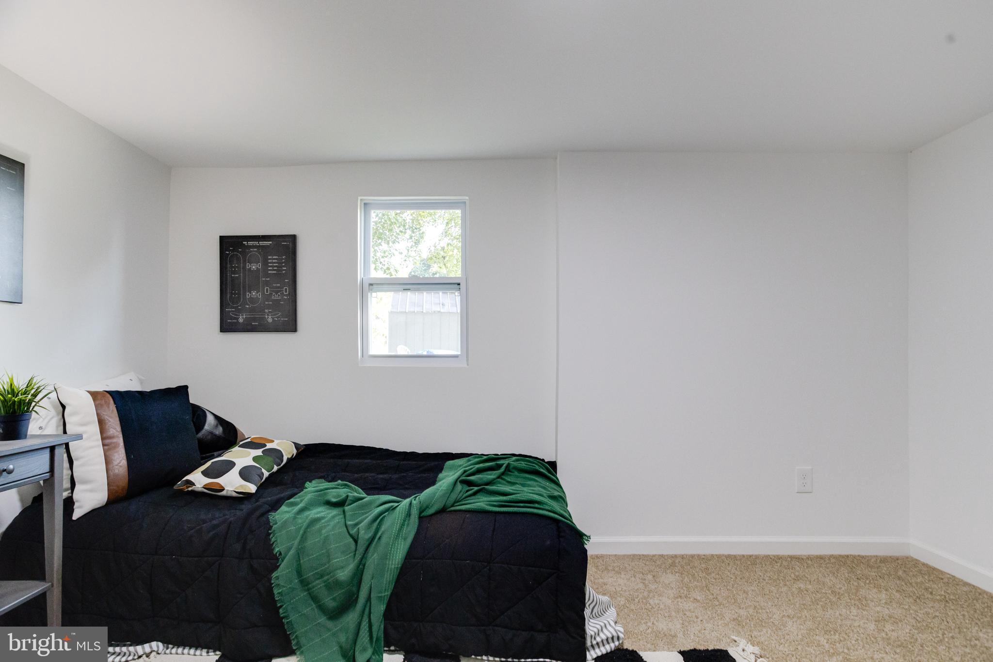 4417 Walnut Road Halethorpe, MD 21227 - Photo 27 of 44 a bedroom with a bed and a window