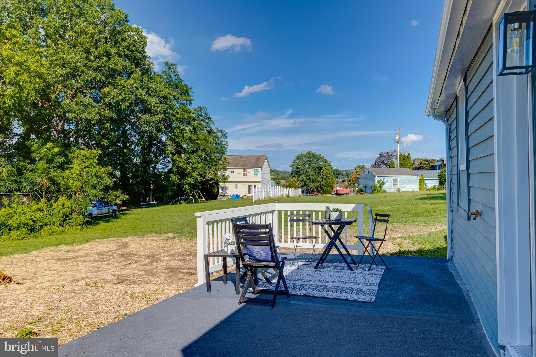 4417 Walnut Road Halethorpe, MD 21227 - Photo 36 of 44 a view of a chairs and table in patio next to a yard