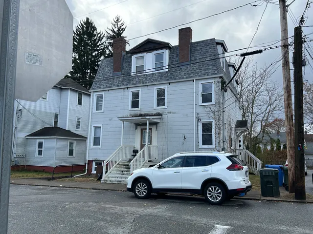 a car parked in front of a house