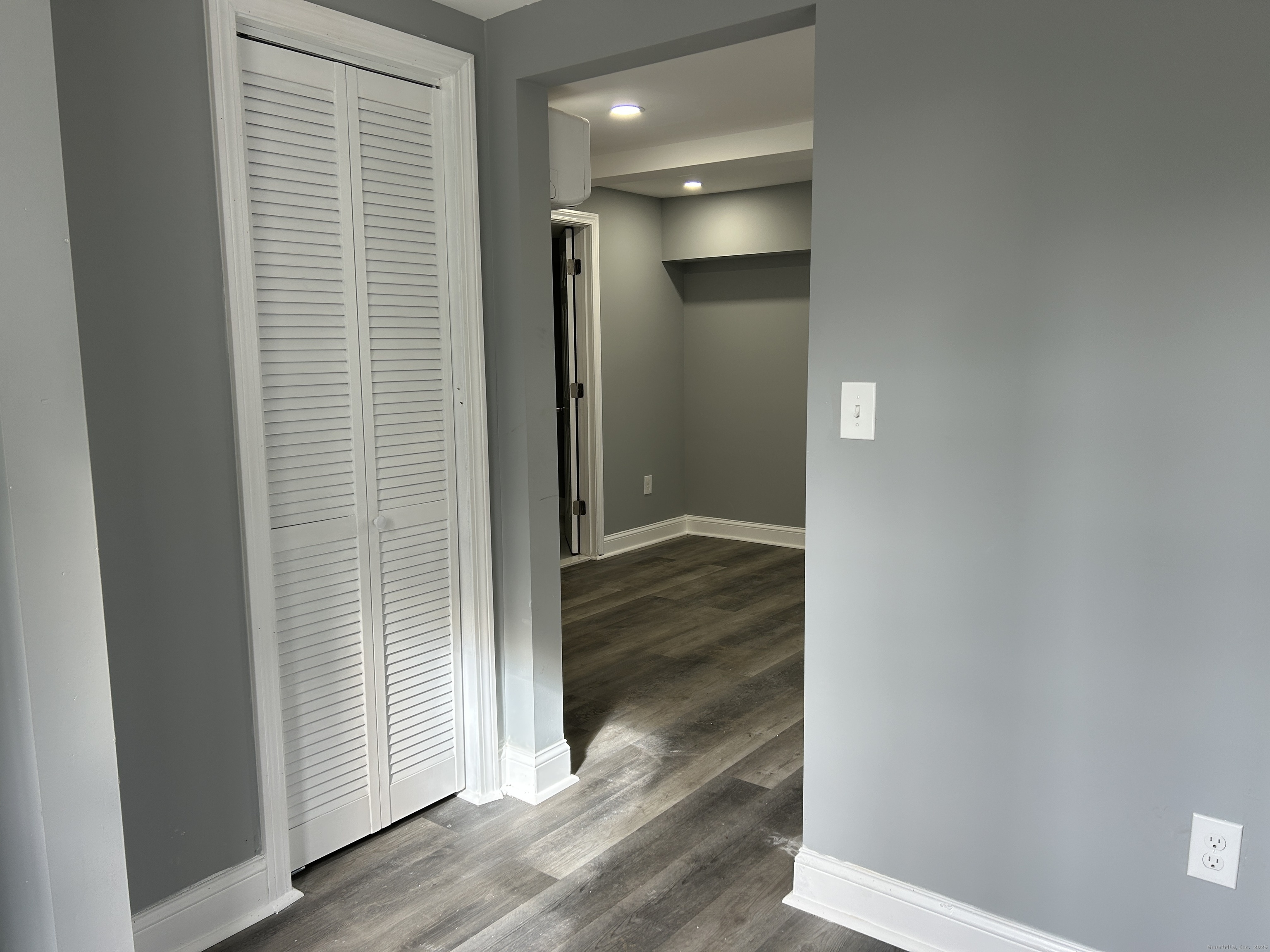 22 Hawthorne Street, Unit 1 Norwich, CT 06360 - Photo 9 of 22 a view of a hallway with wooden floor
