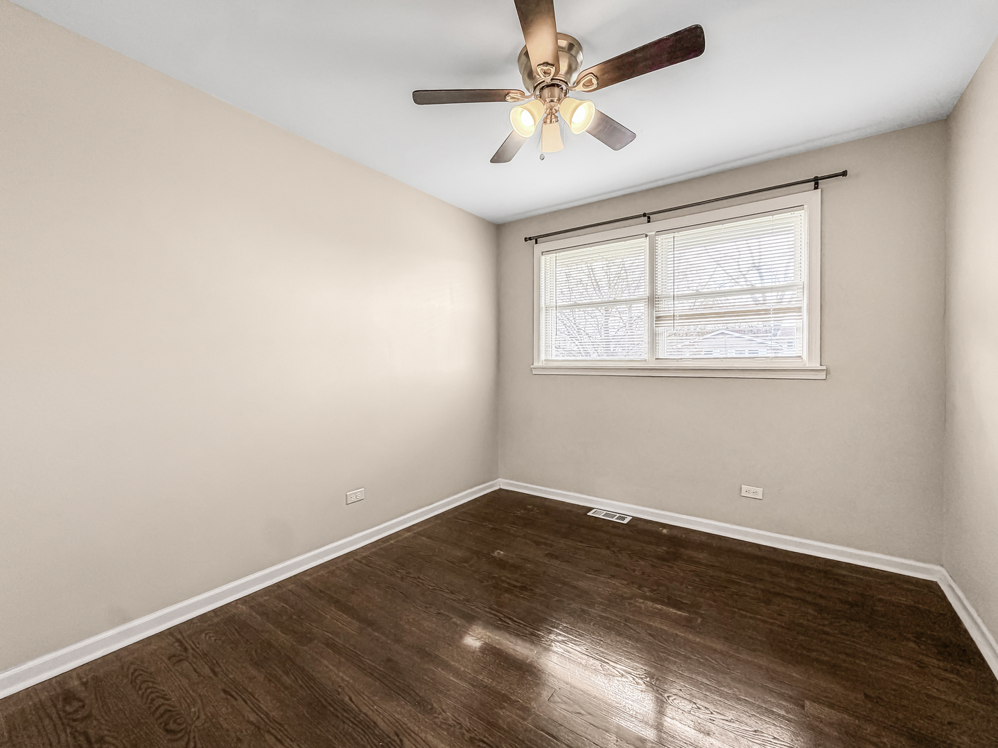 7241 Beloit Avenue Bridgeview, IL 60455 - Photo 11 of 26 an empty room with wooden floor and windows