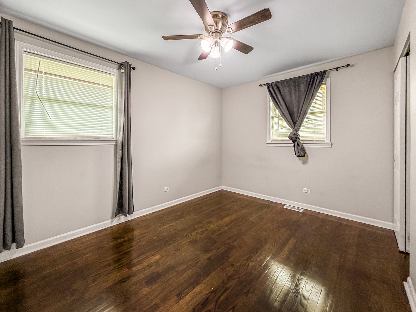 7241 Beloit Avenue Bridgeview, IL 60455 - Photo 14 of 26 a view of empty room with wooden floor and fan