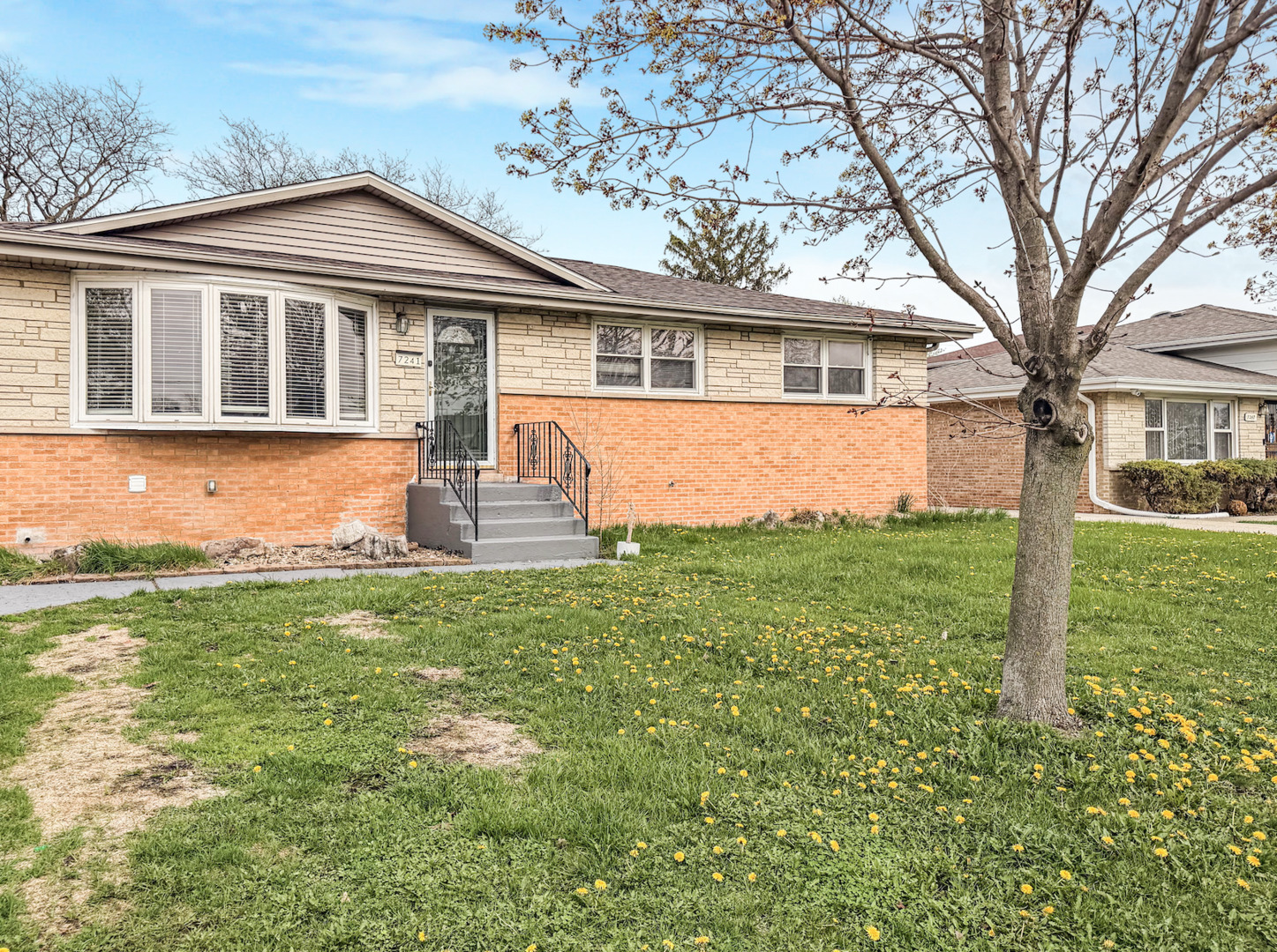 7241 Beloit Avenue Bridgeview, IL 60455 - Photo 2 of 26 a front view of a house with a yard