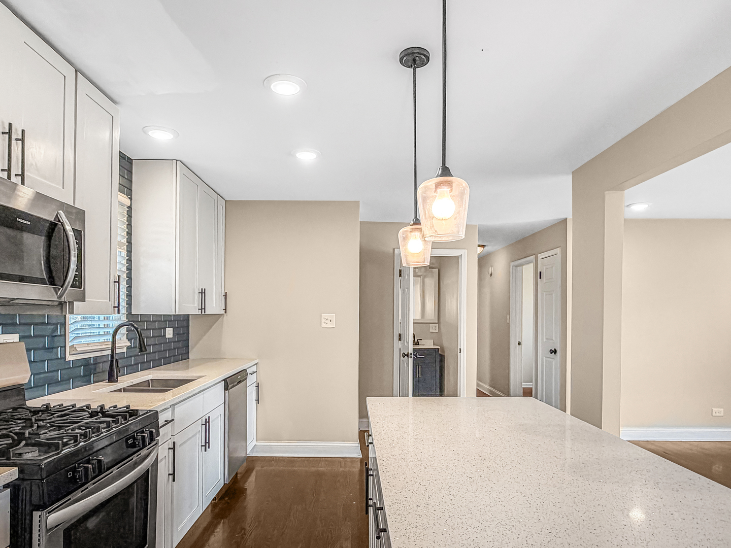 7241 Beloit Avenue Bridgeview, IL 60455 - Photo 6 of 26 a kitchen with stainless steel appliances a stove a sink and a refrigerator