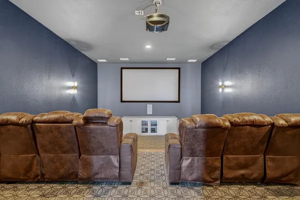 a spacious bedroom with a bed couch and large window