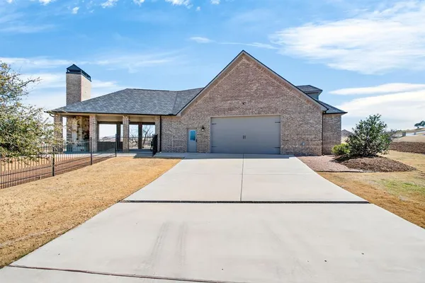an aerial view of a house with outdoor space
