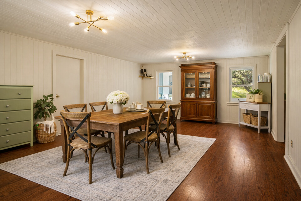435 Spangenberg Road Blanco, TX 78606 - Photo 12 of 38 a view of a dining room with furniture and wooden floor