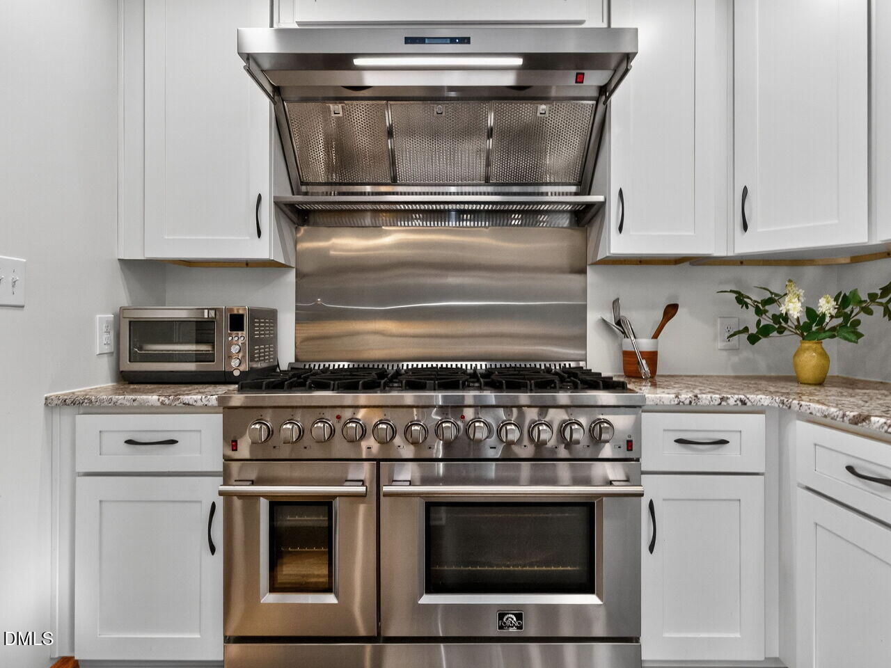 509 Holtz Lane Cary, NC 27511 - Photo 12 of 42 a stove top oven sitting inside of a kitchen