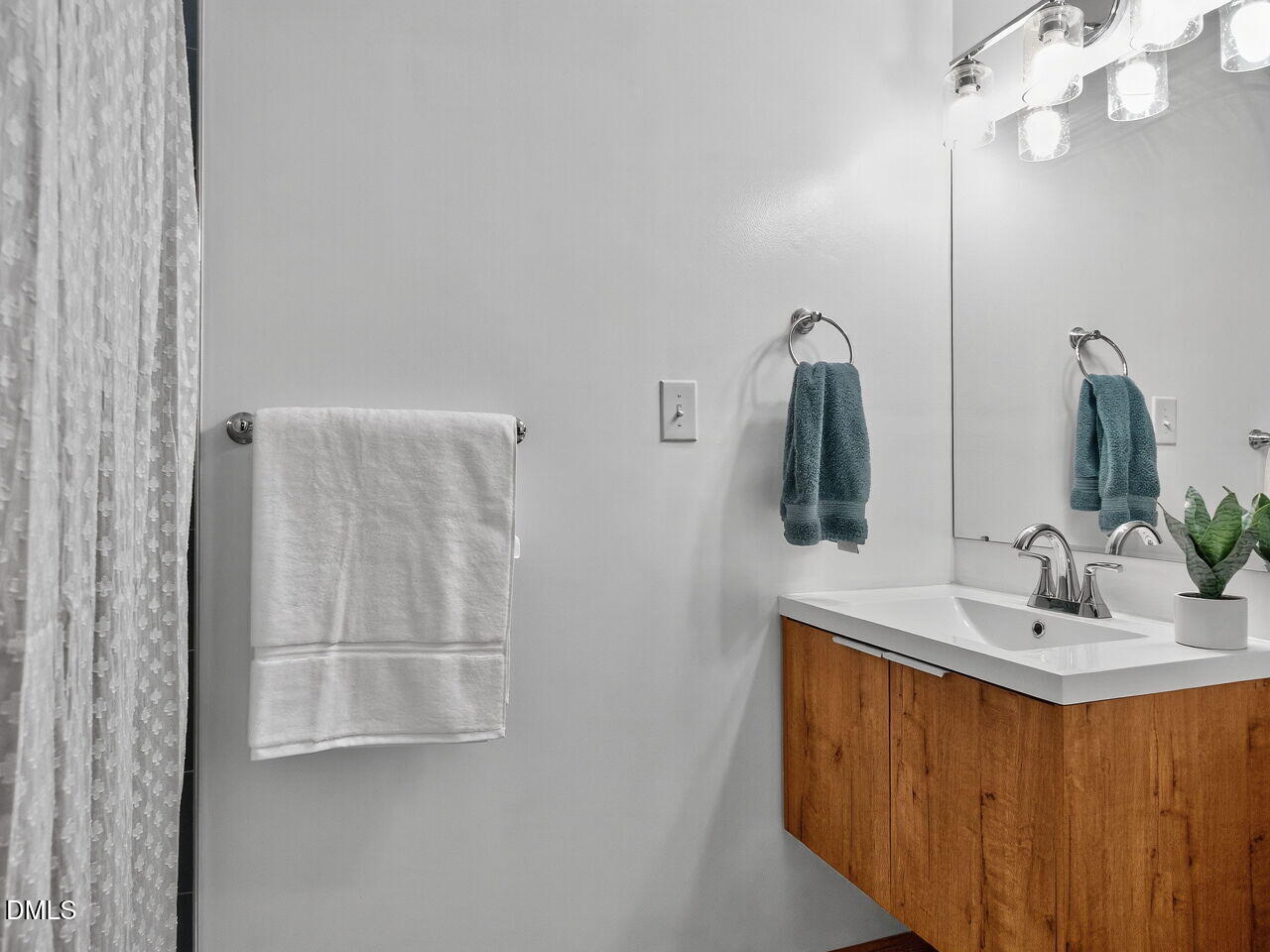 509 Holtz Lane Cary, NC 27511 - Photo 20 of 42 a bathroom with a double vanity sink and a mirror