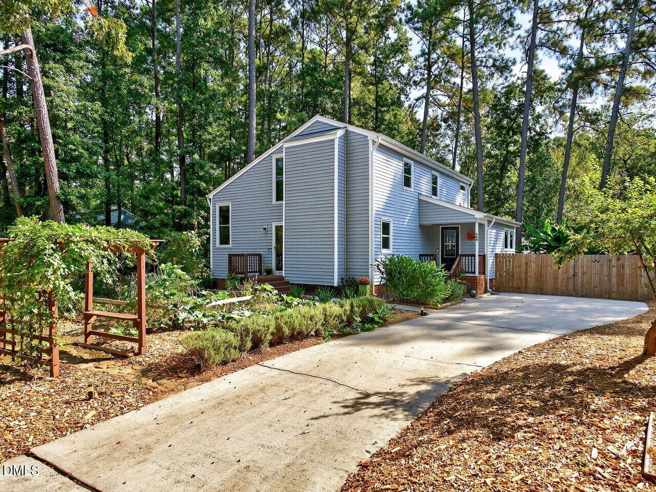509 Holtz Lane Cary, NC 27511 - Photo 2 of 42 a view of a house with backyard and trees