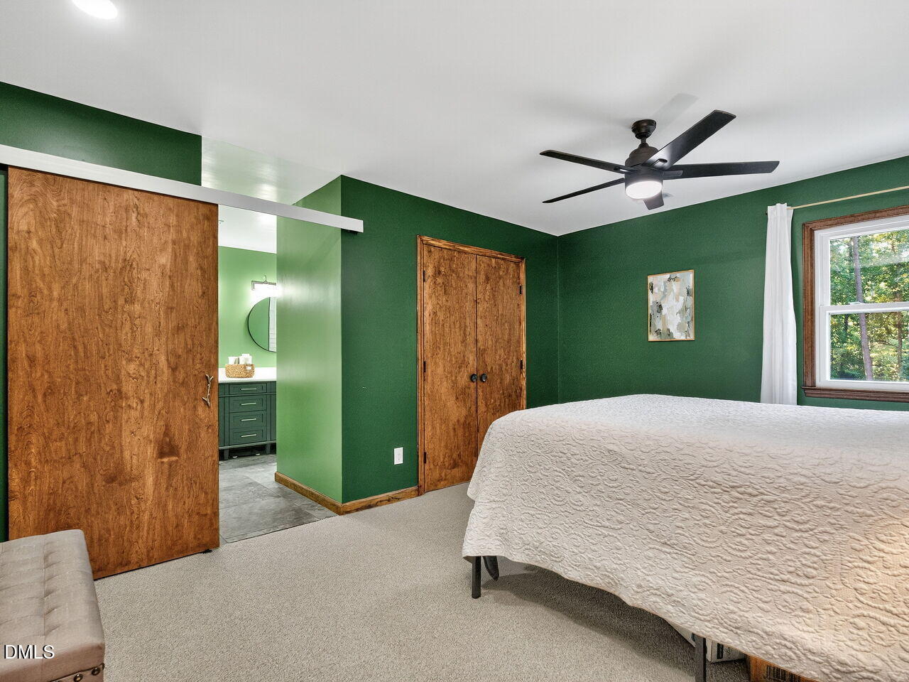 509 Holtz Lane Cary, NC 27511 - Photo 23 of 42 a bedroom with a bed and a large mirror
