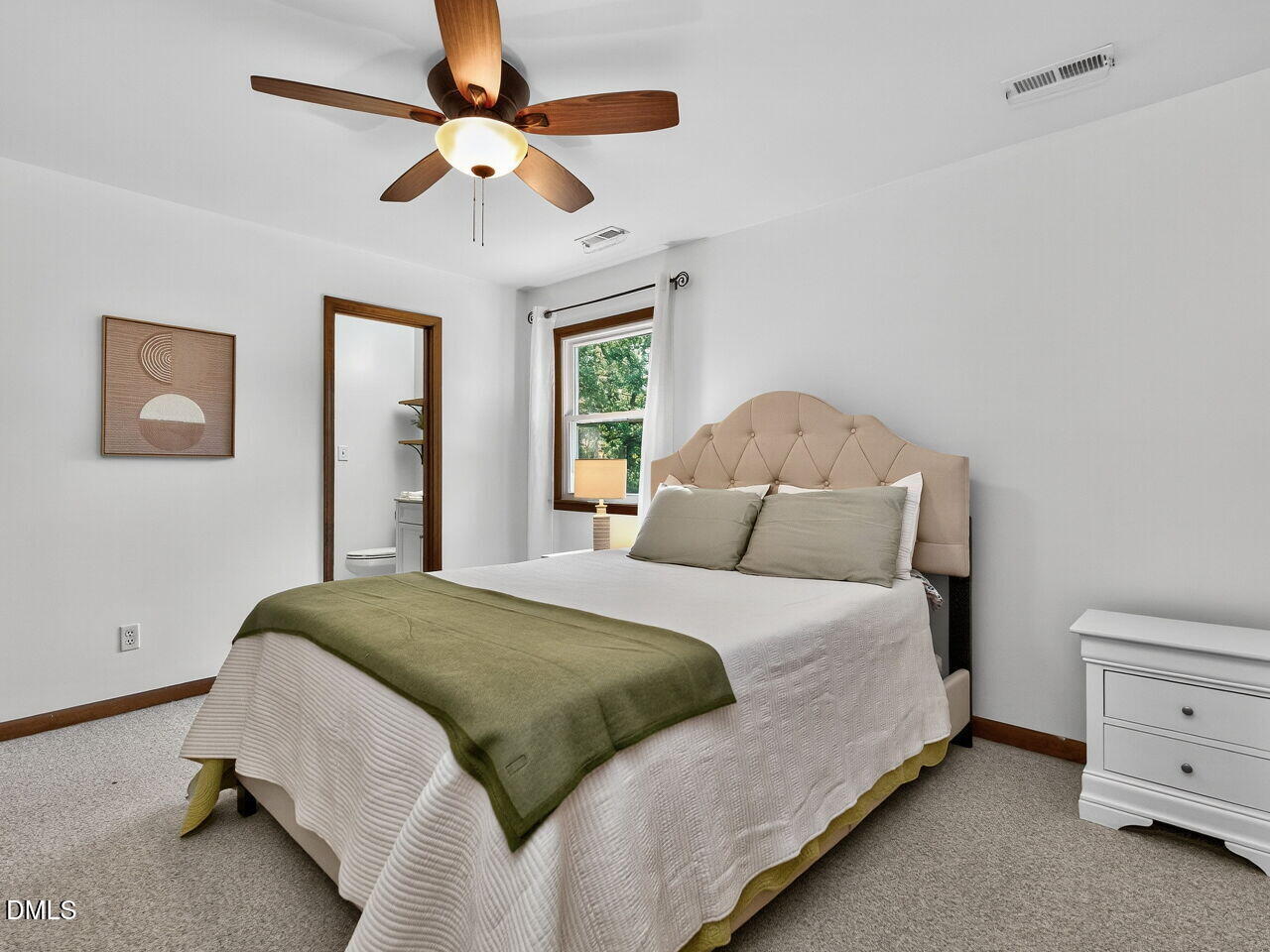 509 Holtz Lane Cary, NC 27511 - Photo 26 of 42 a bedroom with a bed and a ceiling fan